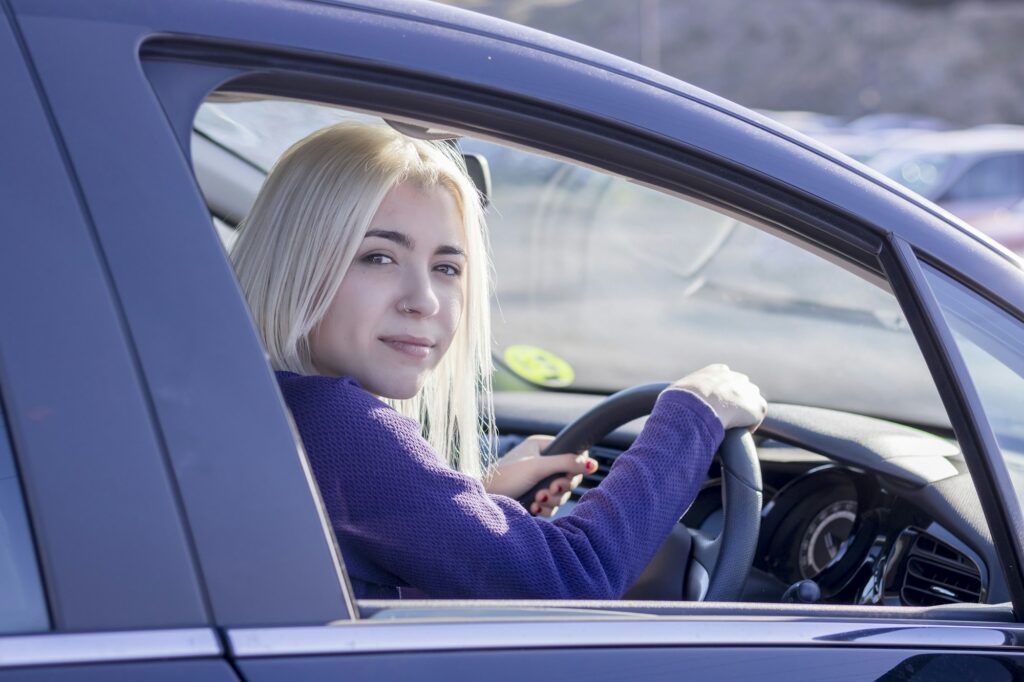 Blonde driver at the wheel